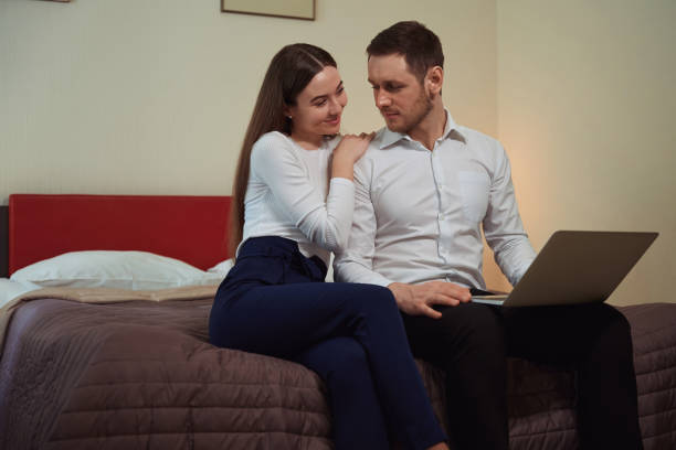 istock Young couple relaxing in the hotel room 1497484314