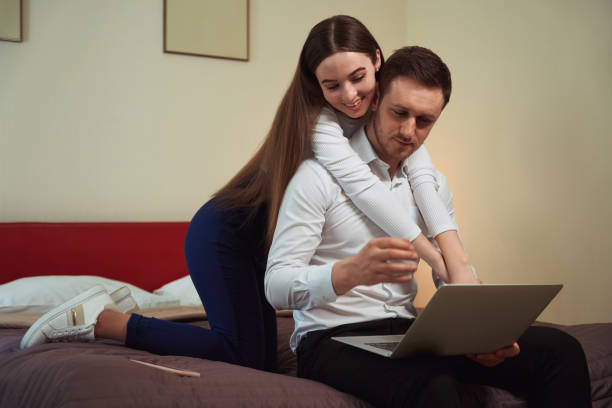 istock Young couple resting in the motel room 1497484316