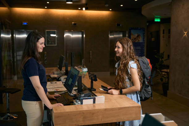 istock Lady speaks to the administrator at the hotel reception 1497489225
