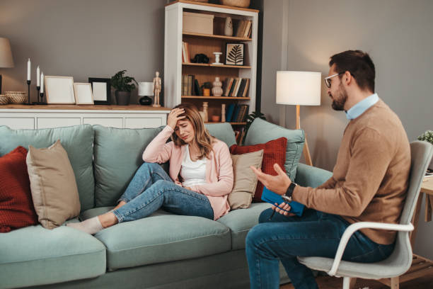 istock Young woman at psychotherapy session 1497489516