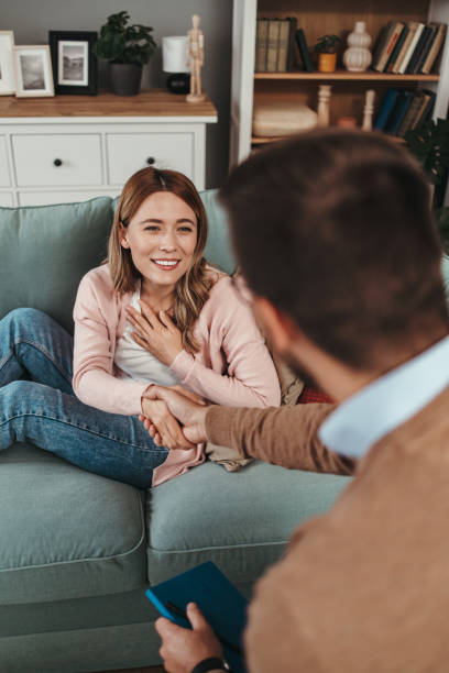 istock Young woman at psychotherapy session 1497489603
