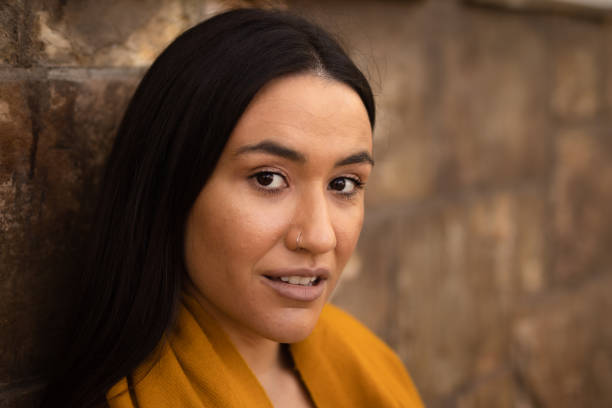 istock Young woman with native features looking towards the camera. Copyspace. 
Empathy 1497489619