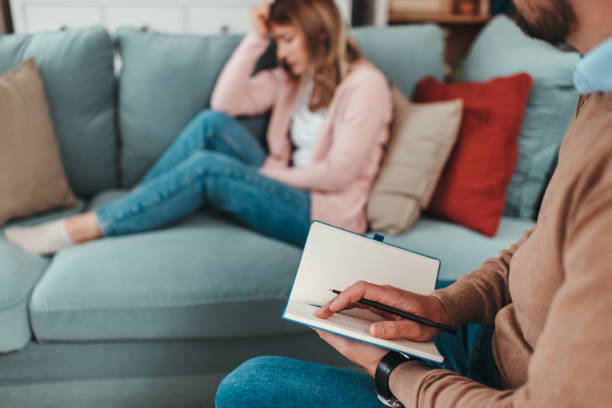istock Young woman at psychotherapy session 1497489718