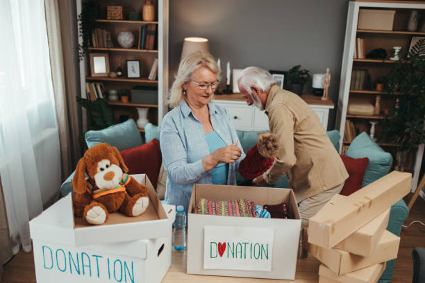 istock Senior couple preparing clothes for charitable foundation 1497493072