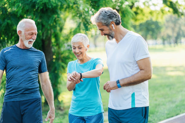 istock Three senior friends jogging together 1497496343