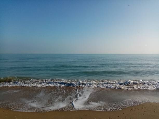 istock The waves rippling on the shore 1497496678
