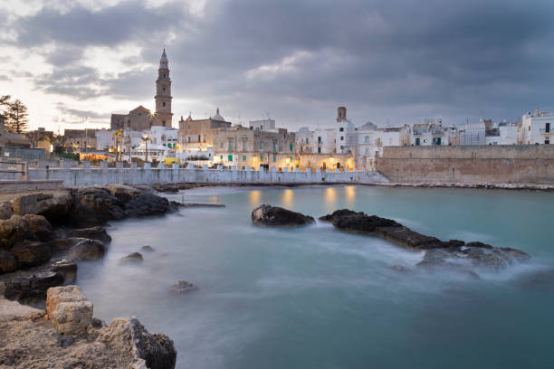 istock Monopoli - The town and coast at dusk. 1497507032
