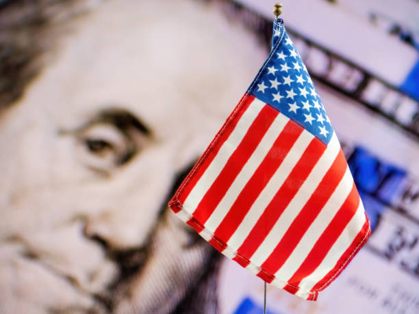 istock American Flag with Dollar Bill Background 1497512703