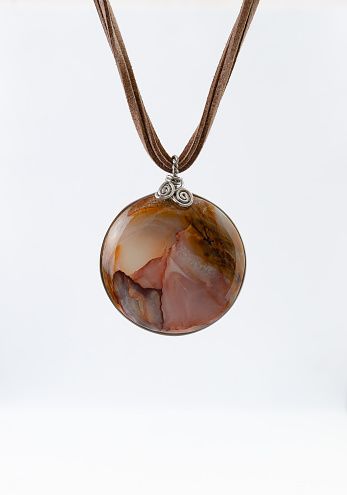 Pendant Made by hand of Inca marble onyx stone, set with wire and suede strips
