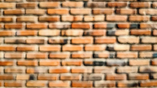 Blurred Brick Wall Abstract Texture. The image is generated with the use of an AI for magical effects