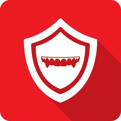 Vector illustration of a shield with vampire fangs icon against a red background in flat style.