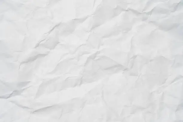 Closeup of white crumpled paper for texture background. Closeup of white crumpled paper for texture background.