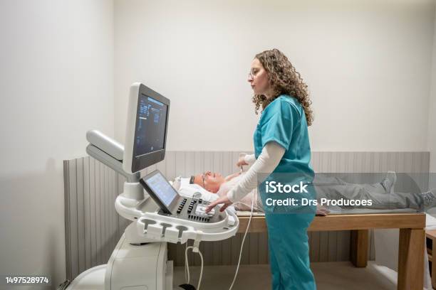 Mature Man Taking An Echocardiogram Stock Photo - Download Image Now - Electrocardiography, Cardiologist, Medical Exam