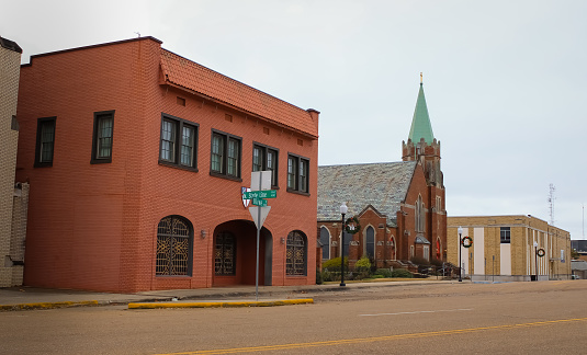 State street with a historic church and a pink building in downtown Texarkana, Arkansas