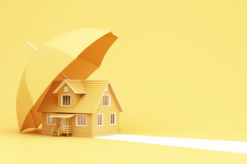 home insurance concept housing residential home cartoon house isometric rendering under umbrella household safety protection illustration 3d rendering on yellow background