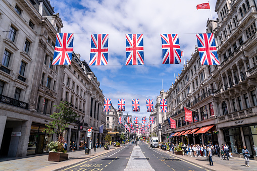 Patriotic British Union Jack flags in London's Regent Street and Oxford Street for the Queen's Platinum Jubilee, marking the 70th anniversary of the Queen's accession to the throne in London, England, United Kingdom.