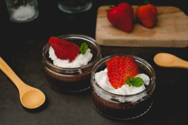 istock Chocolate pudding with cream and strawberry. Sweet dessert and home cooking. vertical 1497546183