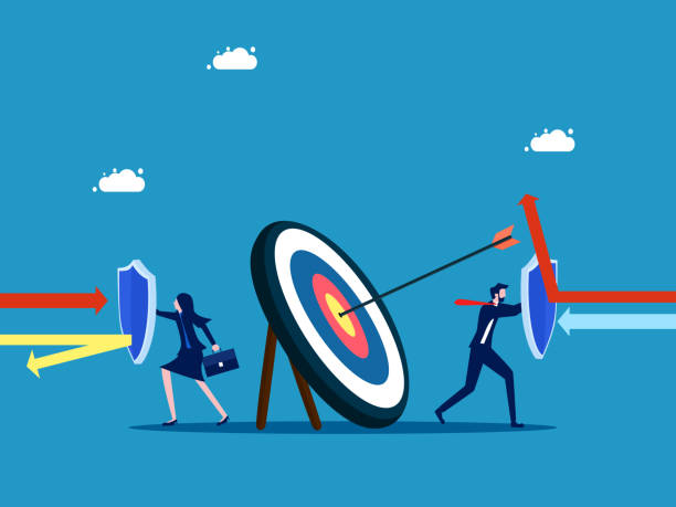 istock Protect the goal. Business man and woman holding a shield to protect the target 1497553481