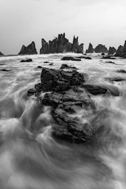 istock Waves and Rocks At Gigi Hiu Beach 1497559465