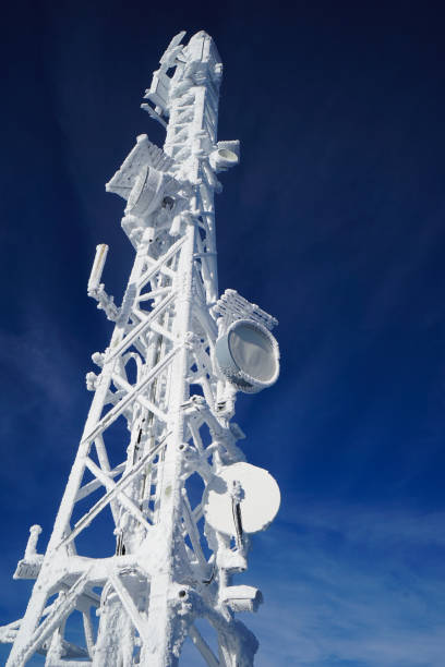 Snow-covered cell towers in winter, Europe