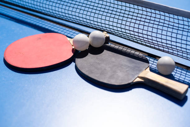 istock sports composition. Ping pong close-up. rackets for playing on a blue background. 1497571424