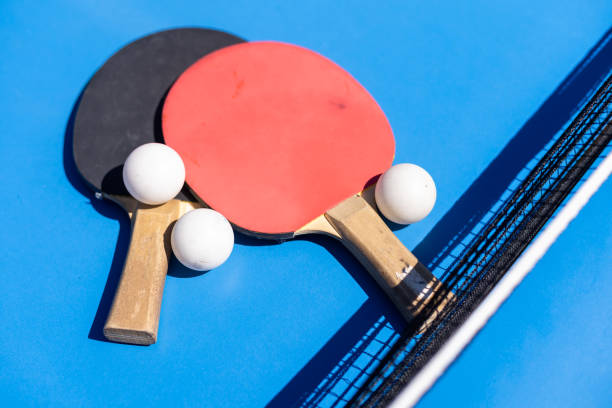 istock sports composition. Ping pong close-up. rackets for playing on a blue background. 1497571502