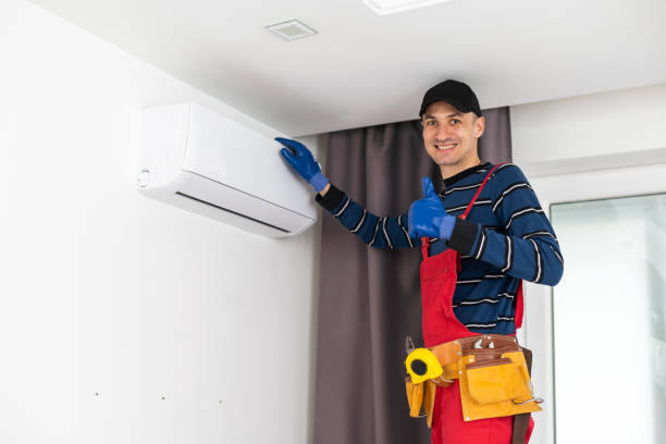 istock technician service checking and repairing air conditioner indoors. 1497573053