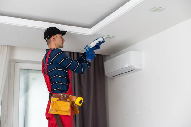 istock working on repairs. the man works on repairs 1497573253