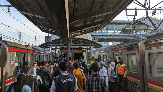 Jakarta, Indonesia - May 14, 2023 : Passengers get off the train at Commuter Line Jakarta Station Tanah Abang.