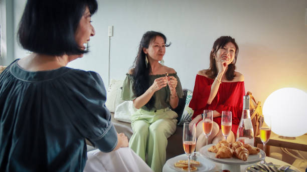 istock A group of women chatting while enjoying afternoon tea snacks and white wine 1497576092