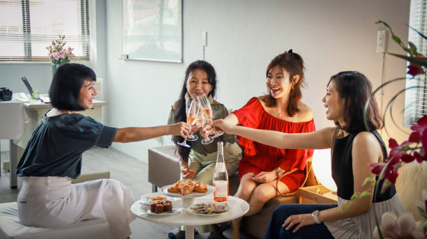 istock A group of women chatting while enjoying afternoon tea snacks and white wine 1497576094