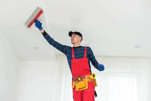 istock working on repairs. the man works on repairs 1497576183