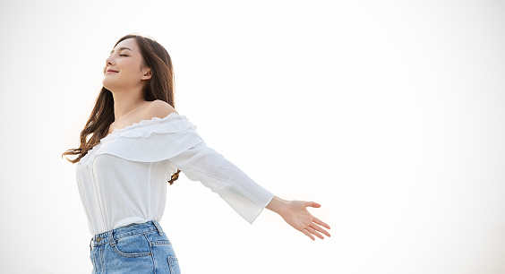 Portrait of young beautiful asian woman hands gesture in open arms on city sky air roof top. Smile face asian lady girl wear casual cloth. Japanese girl lifestyle, lovely woman concept banner