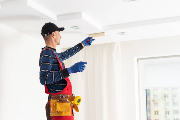 istock working on repairs. the man works on repairs 1497578224