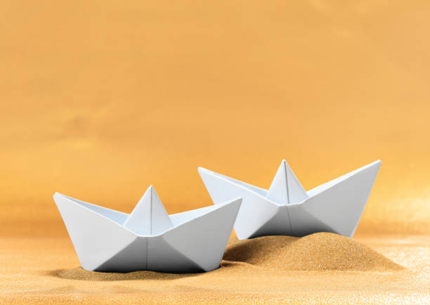 istock two origami boats on the shore 1497582040