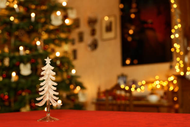 Fir branches, ribbons, pine cones and Christmas lights in outdoor restaurant