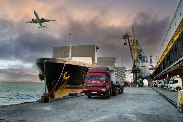 istock Airplane flying over commercial port. 1497583180