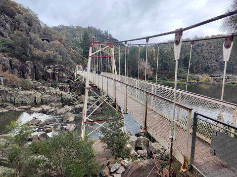 View of the Alexandra suspension bridge on the Cataract Gorge, a river gorge and popular touurist location by the city of Launceston, Tasmania.