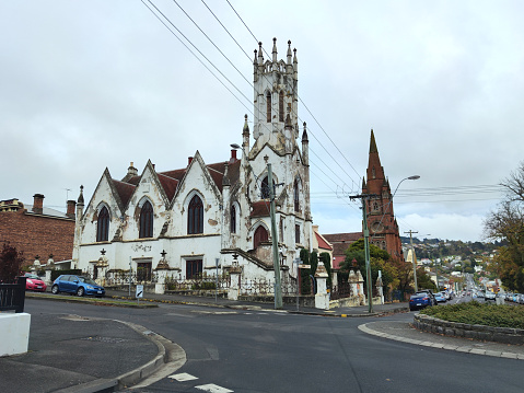 Perth, WA, Australia - November 30, 2017: Unidentified people on William Street and Wesley Uniting church in the capital from Western Australia