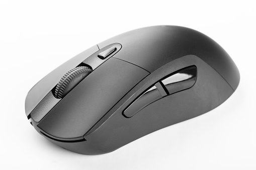 Black wireless computer mouse on a white background. Office equipment