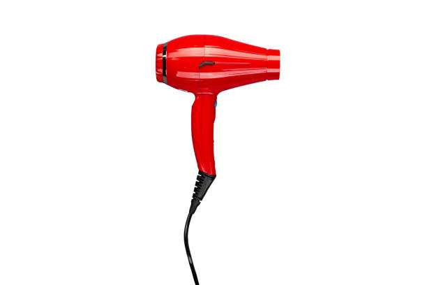 asciugacapelli rosso professionale. isolato su sfondo bianco. - hair dryer single object plastic black foto e immagini stock