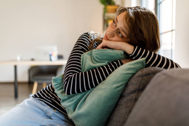 istock Embracing a cozy pillow for emotional support when feeling anxious 1497589784