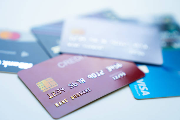 istock Pile of credit cards on table, closeup 1497591408
