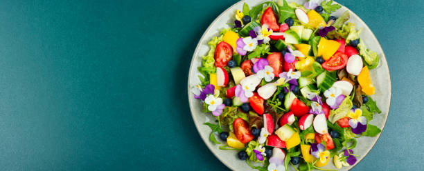 istock Summer salad with edible flowers,space for text. 1497592840