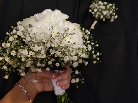a bouquet of bridal flowers. White roses and carnations