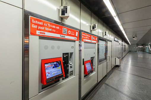A row of ticket machines at a subway station of the Vienna subway system.\nCanon EOS 5D Mark IV, 1/6, f/18, 16 mm.