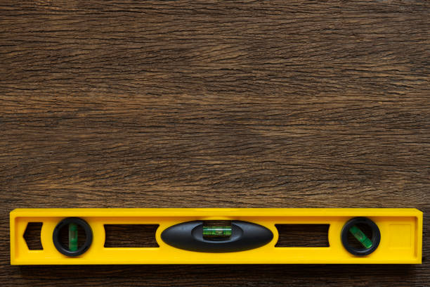 istock Yellow building water level gauge on the old wood table, engineering work tool concept 1497604643