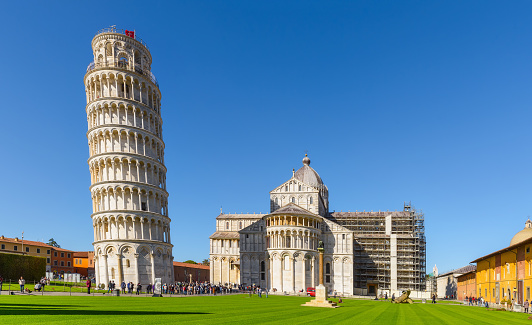 The Leaning Tower of Pisa -Torre pendente di Pisa-  It is located in Piazza dei Miracoli. It's also third oldest built structure in Pisa's Piazza dei Miracoli after Cathedral and the Baptistery. Horizontal composition. Front view.