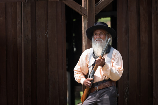 vintage style portraits of a cowboy man on a farm