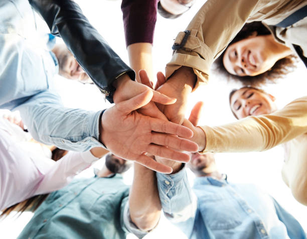 istock holding young man woman student together hand team teamwork friendship unity startup hands woman friend group education cooperation community support 1497613211